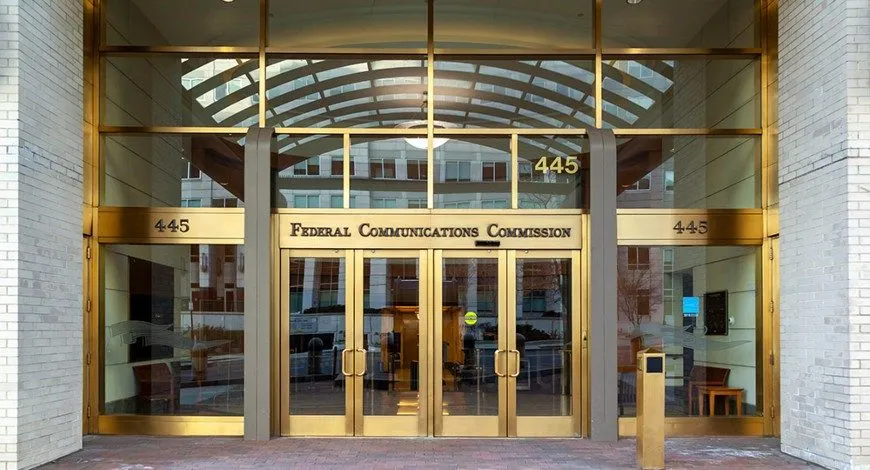 The entrance of the Federal Communications Commission headquarters in Washington, DC, marked 445.