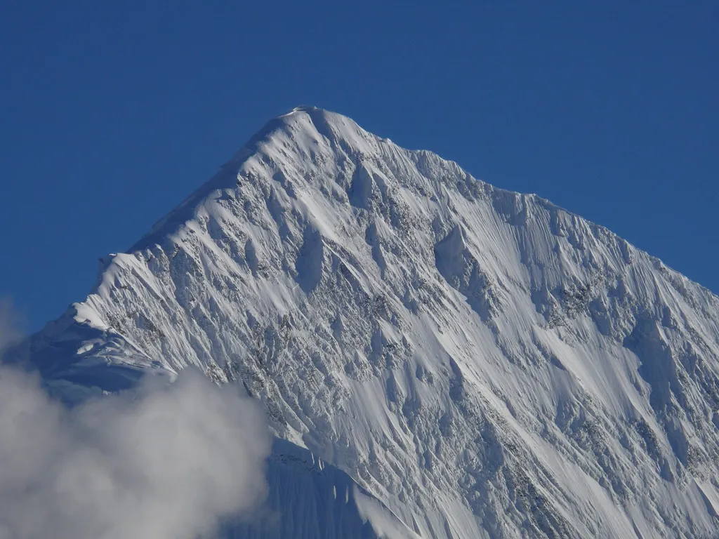 Snow-covered Gangapurna mountain in Nepal's Annapurna region, seen from Thorung Phedi