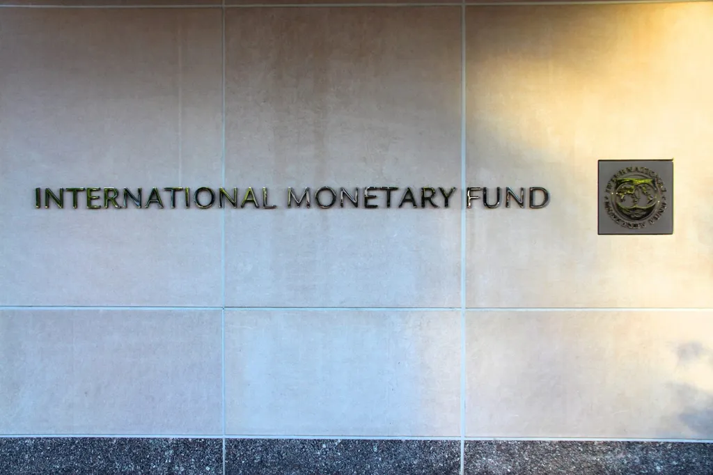 The International Monetary Fund name and seal on the wall of the IMF headquarters building in Washington DC