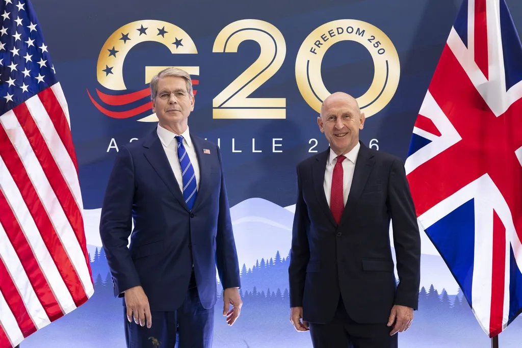 Chancellor John Healey (right) beside the US Treasury Secretary at the G20 finance ministers' meeting, with British and American flags.