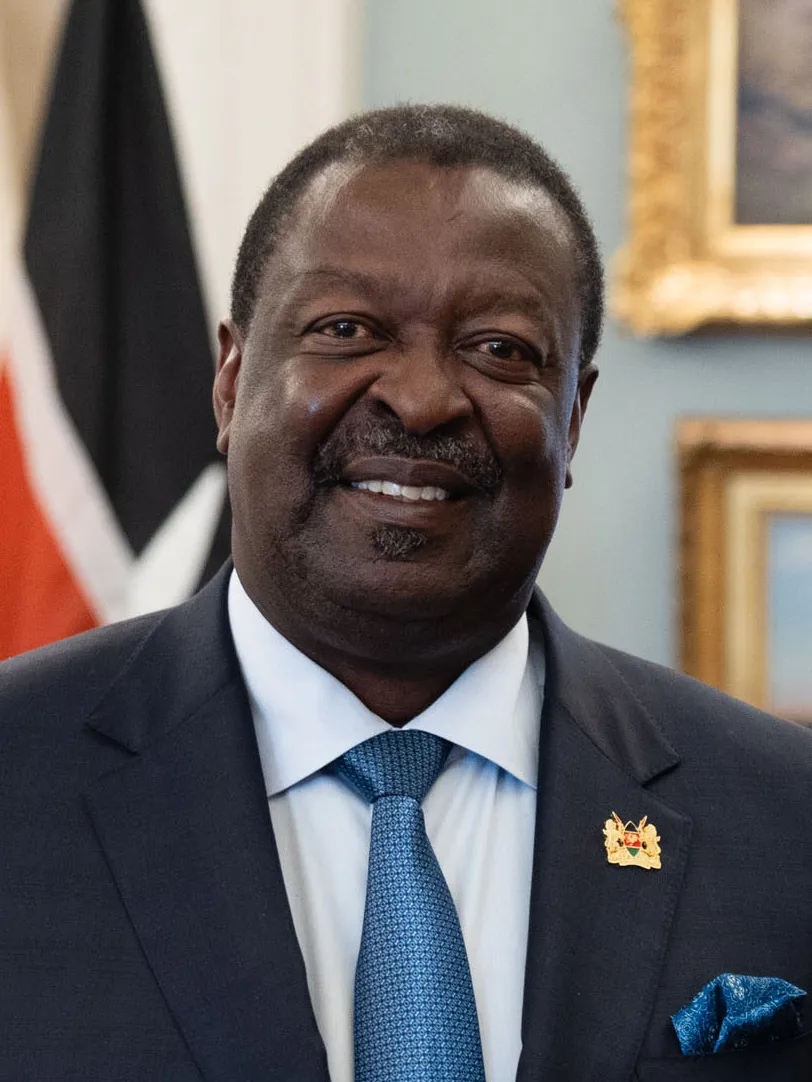 Kenya's Prime Cabinet Secretary Musalia Mudavadi in a suit with a Kenyan flag pin, photographed at the U.S. Department of State in Washington, D.C.
