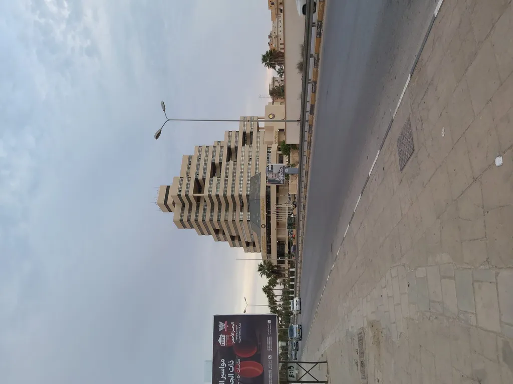 The Libyan House of Representatives building in Benghazi, flying the Libyan flag