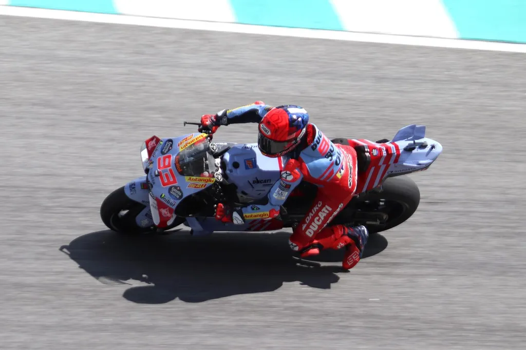 Marc Marquez (No. 93) leaning his Ducati into a corner during a MotoGP race at Sepang; file photo (2024 Gresini Ducati — he races the factory Ducati Lenovo Team in 2026).