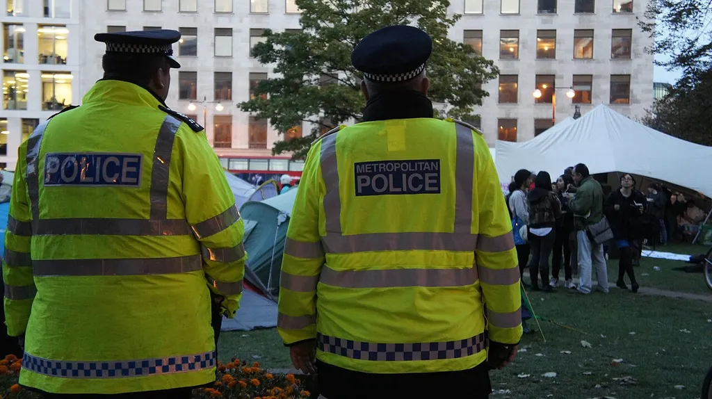 Metropolitan Police officers in hi-vis jackets on duty in London