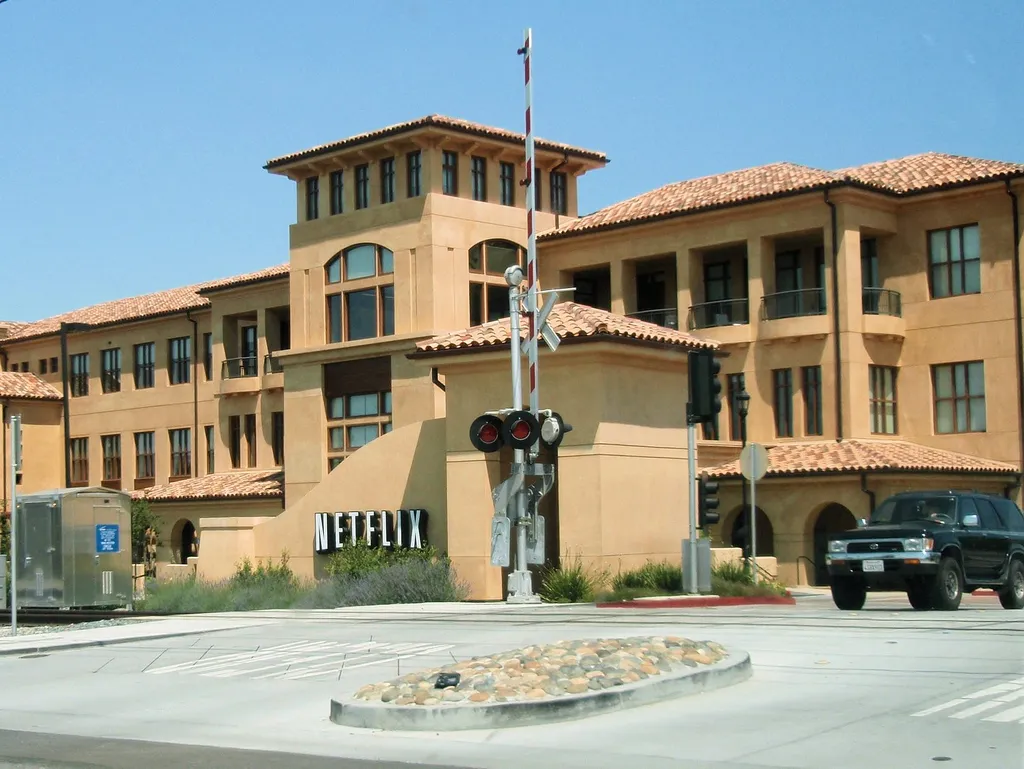 Netflix headquarters campus in Los Gatos, California, with the company signage at the entrance.