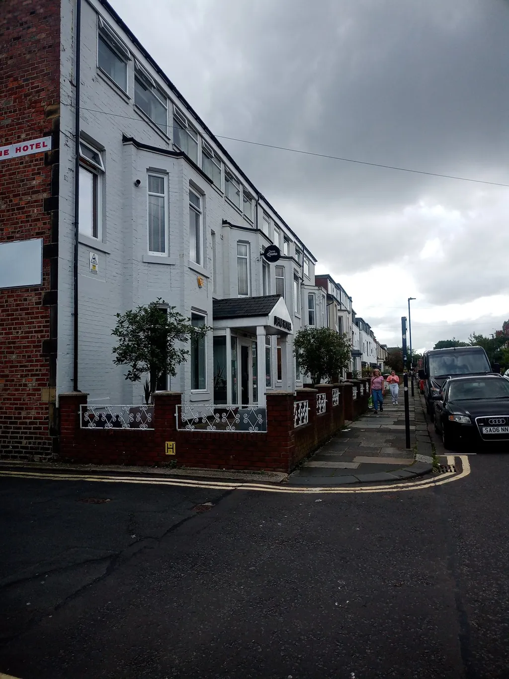 Street view of the white-painted OYO Dene Hotel building, an Oyo-branded property in the UK