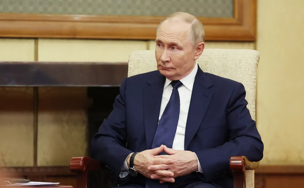 Vladimir Putin seated during a meeting, in an official Kremlin photograph from September 2025.