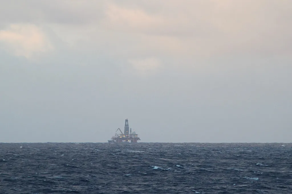 An offshore oil platform on the horizon in the North Sea off Scotland