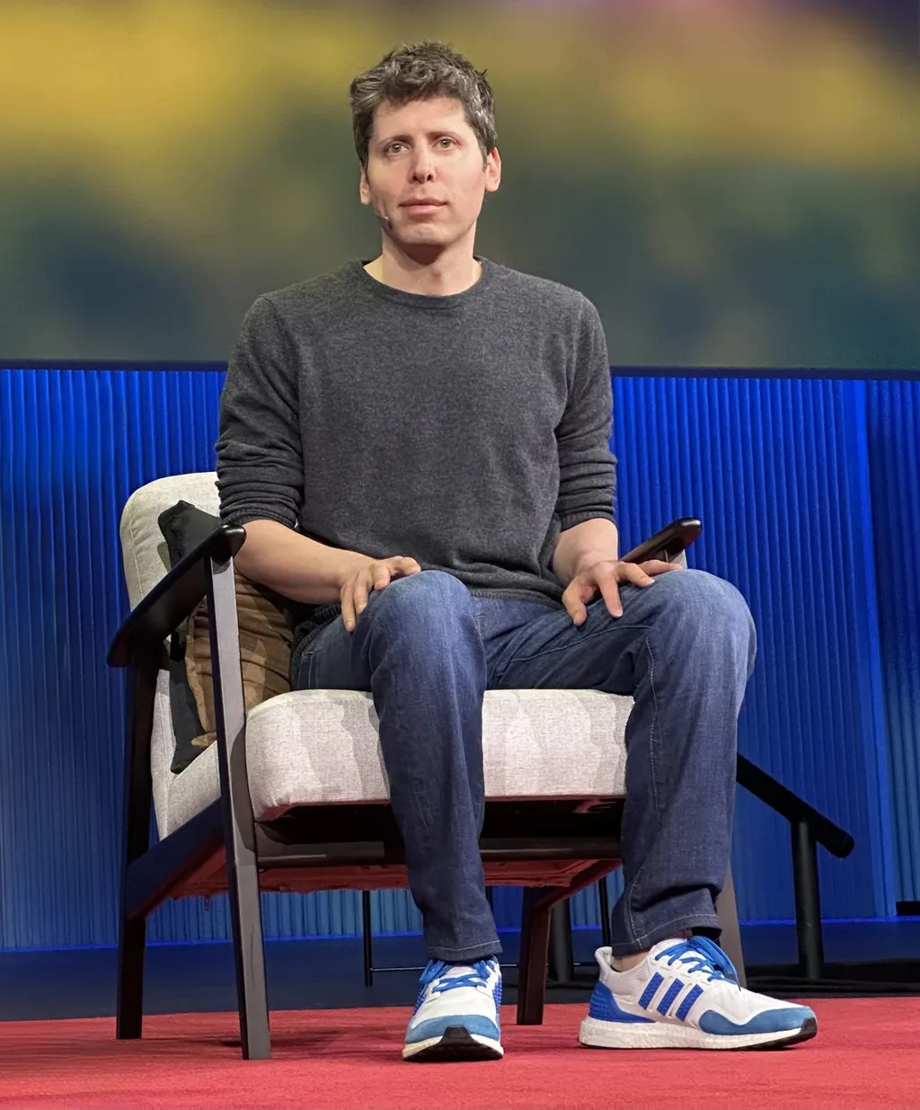 OpenAI chief executive Sam Altman seated on stage during a TED talk in April 2025