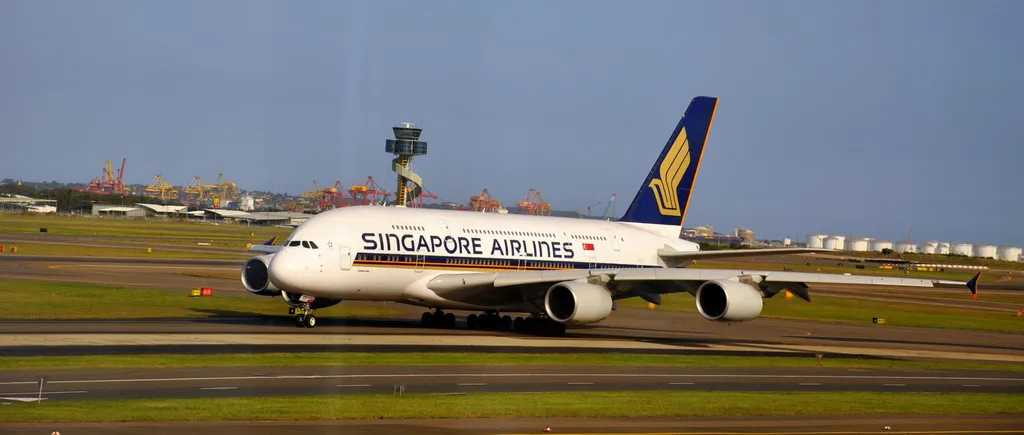 A Singapore Airlines Airbus A380 in the airline's blue-and-gold livery on the taxiway at Sydney Airport