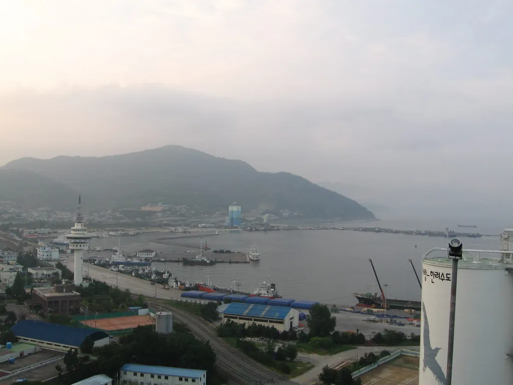 Harbour view of the Port of Yeosu, South Korea, with moored vessels, cranes and dock facilities — illustrating the South Korean ports at the centre of disputed allegations that fuel was loaded for shipment to Russia.