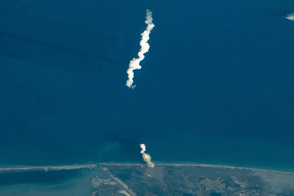 Launch plume of a SpaceX Starship rocket seen from the International Space Station as it climbs from Starbase, Texas