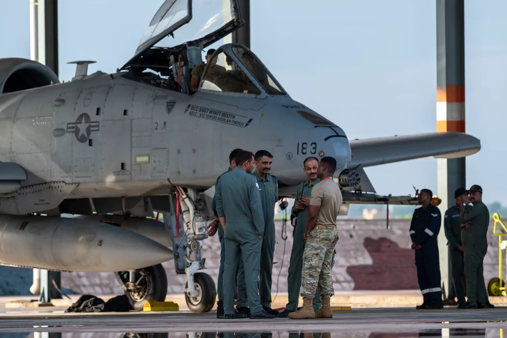A US Air Force airman talks with Indian Air Force members beside an A-10 Thunderbolt II at Jodhpur during the Tarang Shakti exercise.