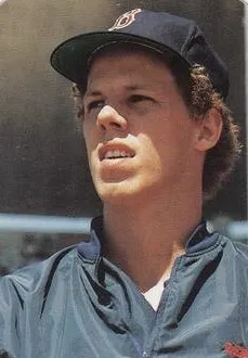 Portrait of Todd Benzinger in a Boston Red Sox uniform and cap, from the 1986 Boston Red Sox photo cards set