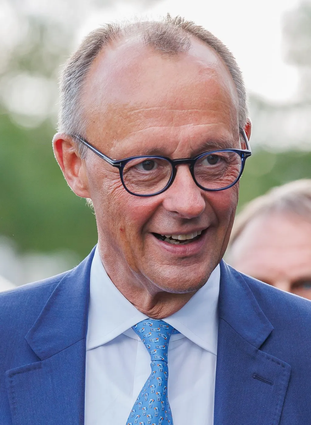 German Chancellor Friedrich Merz photographed in Erfurt in August 2024, wearing a blue suit and glasses.