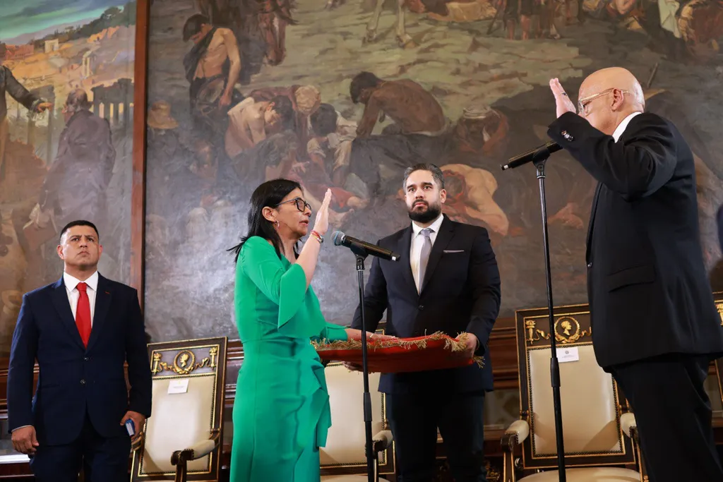 Delcy Rodríguez, acting president of Venezuela, raises her hand as she is sworn in at a ceremony in Caracas on 5 January 2026.
