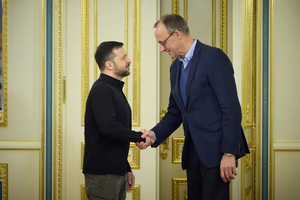 Volodymyr Zelenskyy shakes hands with Friedrich Merz during their meeting in Kyiv in December 2024